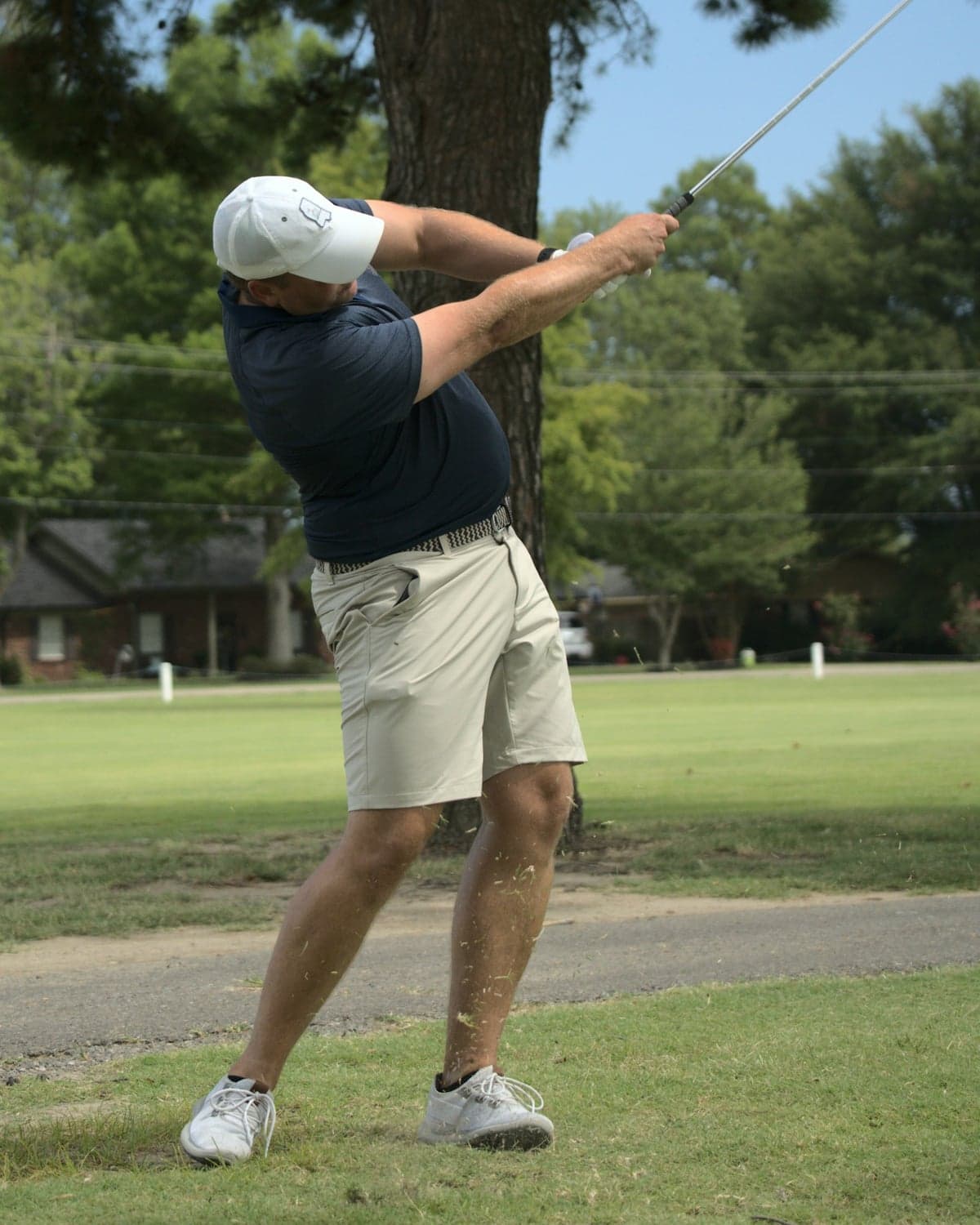 Golfer in mid-swing follow-through