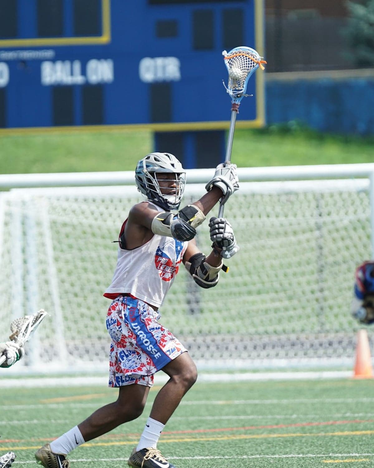 Youth lacrosse player working the field